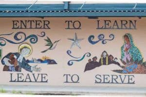 San Miguel High School Mural that Reads "Enter to Learn, Leave to Serve"