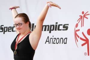 Person at Special Olympics Arizona with Medal